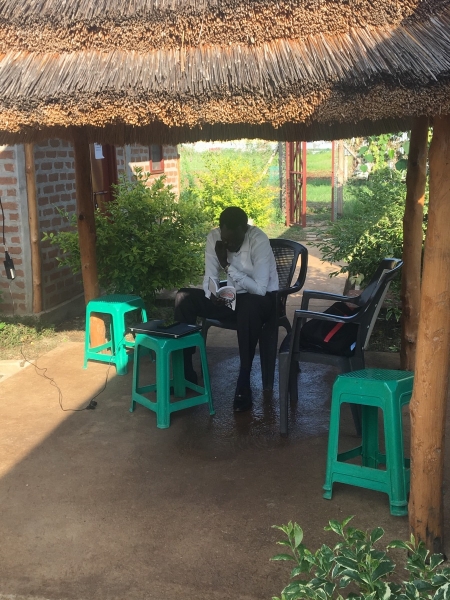 Machot Amuom, SSCA researcher, takes some time out to read Douglas Johnson’s latest book, a short history of South Sudan, on an early morning at the RVI office in Juba.