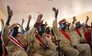 Executive chiefs in South Sudan, wearing red sash of office