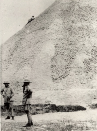 Percy Coriat climbing Ngundeng's Mound, January 1928 (Coriat’s photos, Pitt-Rivers Museum)